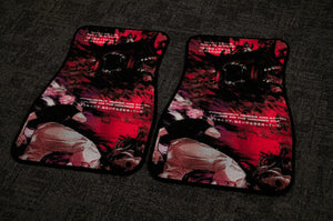 The "Gojo vs Sukuna, Domain Expansion!" floor mats by Incompletegl feature an intense anime design with dark red and black tones, depicting a monster with an open mouth and characters dressed in white and black outfits engaged in a cursed energy battle. Japanese text is also displayed across the mats, all set against a dark carpet backdrop.