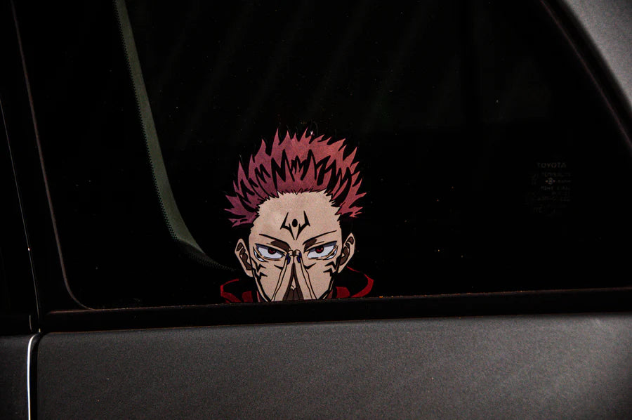 Sticker featuring an animated character from the Jujutsu Kaisen Mystery Pack by Incompletegl, showcasing pink hair and intense eyes with clasped hands on a car window. The dark background and metallic gray car door evoke the anime's dramatic style.