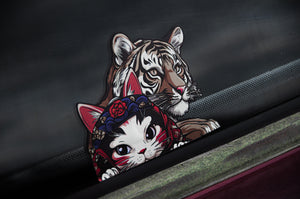 Check out the Neko & Lion! | Holographic Peeker Decal by Incompletegl, featuring a realistic lion and an adorable neko cat in a vibrant headdress, both playfully peeking from behind the car window edge. The neko exudes charming cartoon-style elements with a holographic finish.