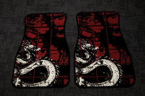 Two Chaos Red Checkered! Floor Mats by Incompletegl are displayed on a dark grey surface, featuring an illustrated white Japanese dragon with red accents set against a black and red checkered pattern. The design beautifully blends traditional Japanese art elements with modern aesthetics.