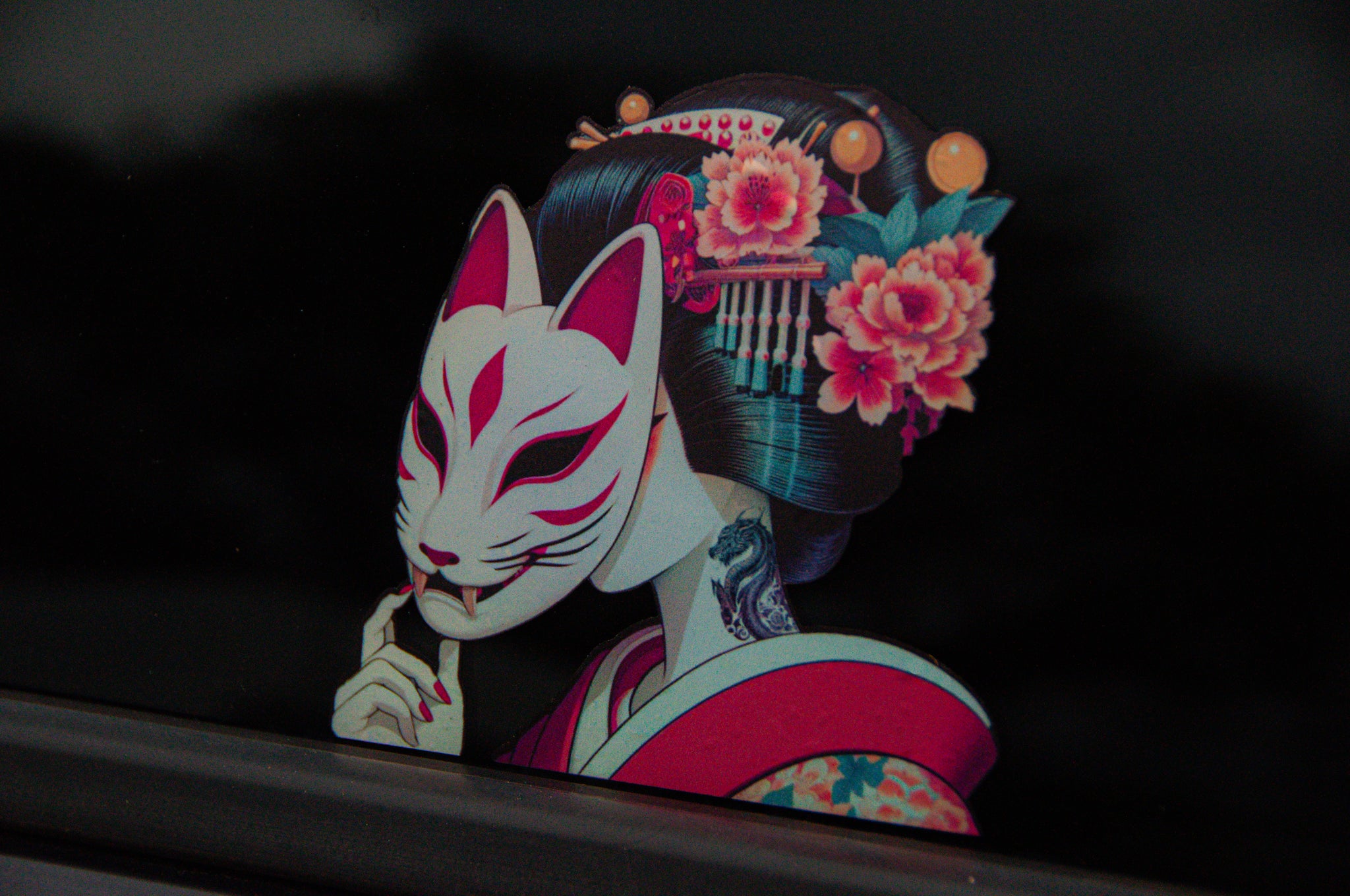 Illustration from the Geisha Mega Pack! by Incompletegl, featuring a person in traditional Japanese attire holding a white fox mask in front of their face. The figure boasts elaborate hair ornaments and pink flowers nestled into dark hair, with a dragon tattoo visible on their neck. The background is dark and blurred, capturing the elegance of geisha artwork.