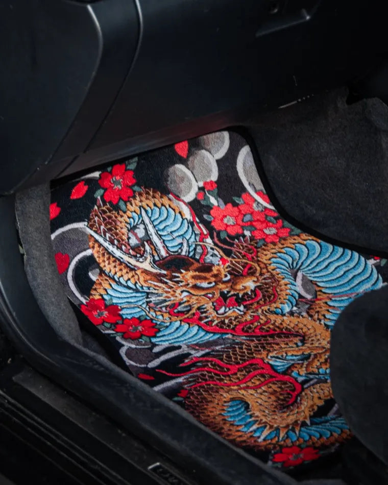 The Dragon Tattoo floor mat in the driver footwell