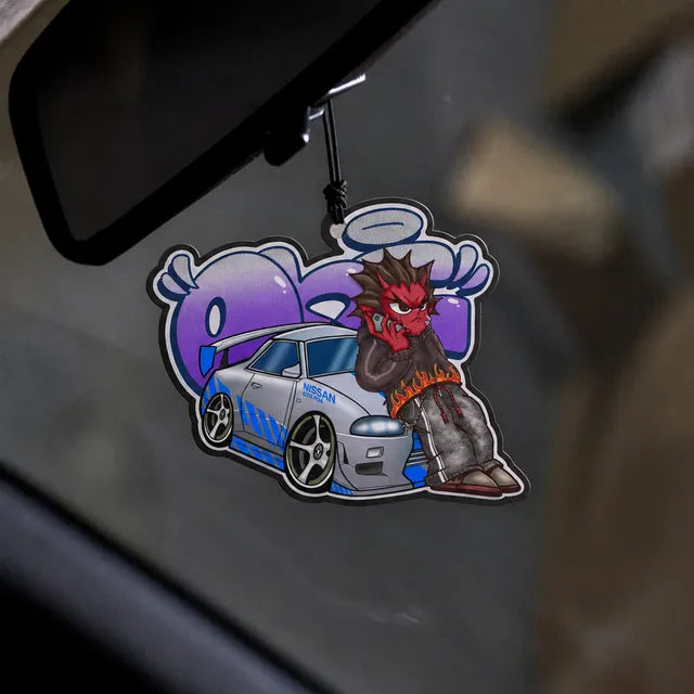 October winning design: red yokai leaning on a silver R34 GT-R, air freshener