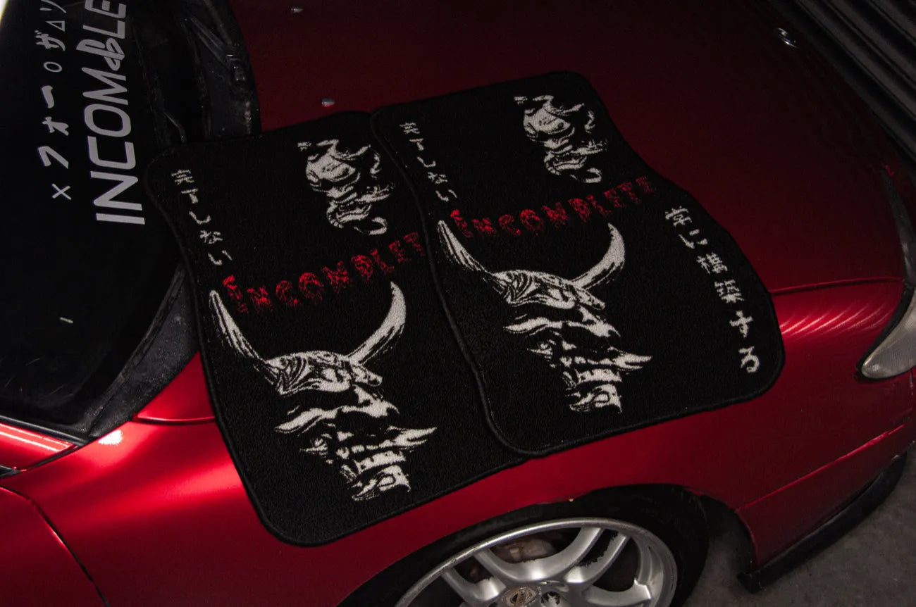 Oni floor mats on a red car